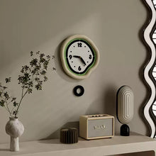 Cream minimalist wall clock with pendulum for modern home decor