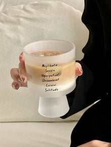 Lettered glass coffee cup with modern typography design