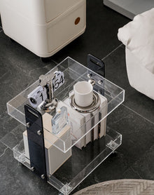 Clear acrylic two-tier bar cart with wheels for drinks and glassware