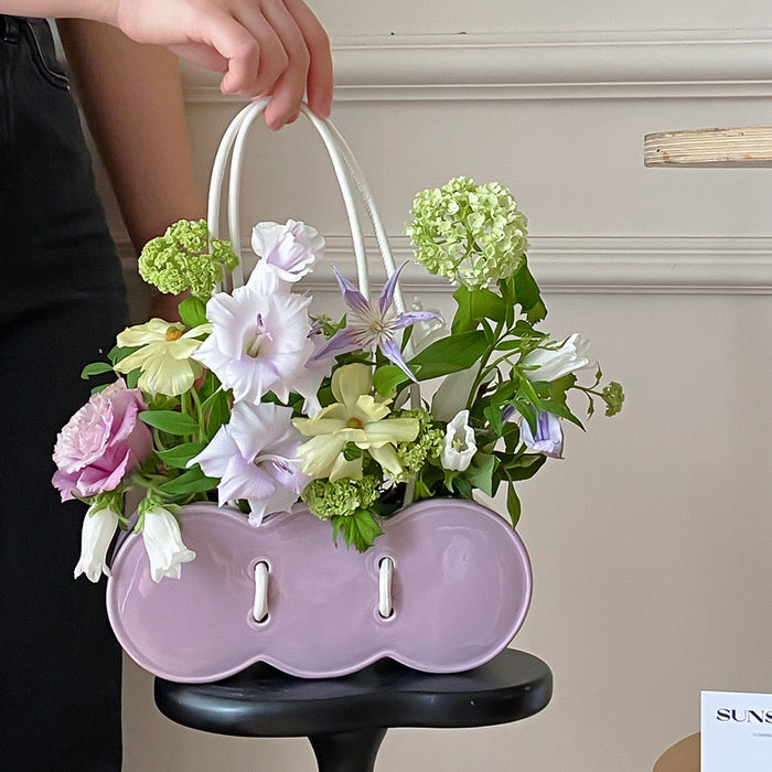 Purple handbag-shaped ceramic flower vase for decorative home styling