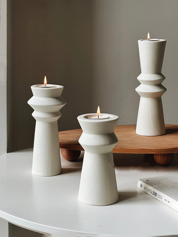Set of three minimalist ceramic candle holders for modern home decor