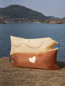 Inflatable outdoor lounger sofa for portable seating at the beach, campsite or garden