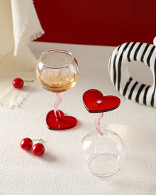Set of two heart base wine glasses with curved stems