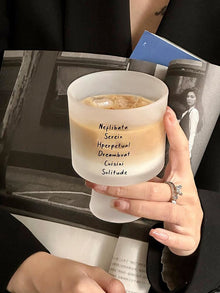 Lettered glass coffee cup with modern typography design