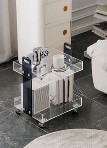 Clear acrylic two-tier bar cart with wheels for drinks and glassware