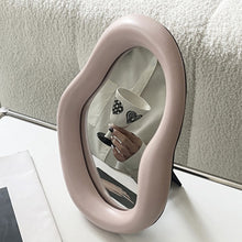 Beige irregular shaped vanity mirror for makeup and dressing table use