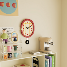 Red grid wall clock with pendulum and retro dot hour markers