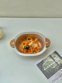 Bear-shaped stainless steel serving bowl with walnut wood ear handles