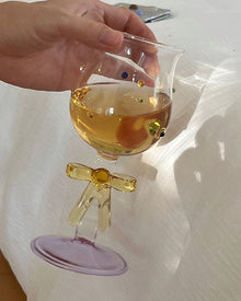 Handmade ribbon charm glass goblet with amber stem, lilac base, and colorful bead accents