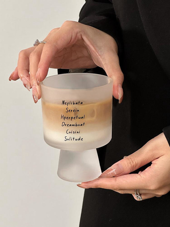 Lettered glass coffee cup with modern typography design