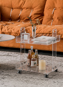 Clear acrylic two-tier bar cart with wheels for drinks and glassware