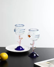 Ocean-inspired wine glass with fish motif and coral-style stem