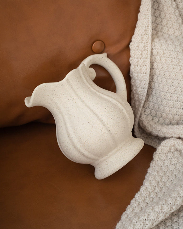 Vintage ceramic teapot vase with curling handle and fluted body