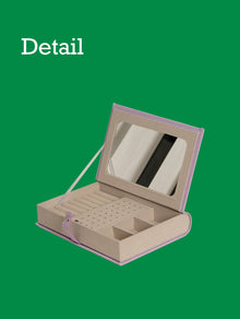 Green book-shaped jewelry storage box for rings, earrings, and necklaces