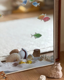 Ocean fish mirror wall art with marine-inspired fish and shell motifs