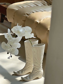 Boot-shaped ceramic flower vase for decorative home styling