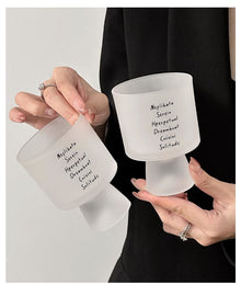 Lettered glass coffee cup with modern typography design