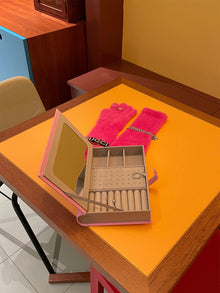Green book-shaped jewelry storage box for rings, earrings, and necklaces