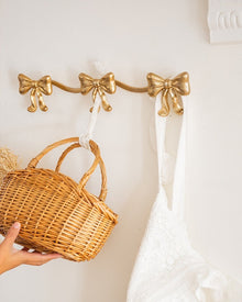 Vintage bow triple wall hook with antique-style finish
