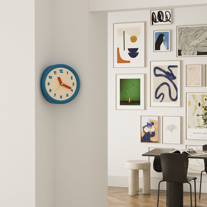 Blue corner wall clock with minimalist dot dial for a 90-degree wall edge