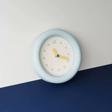 Baby blue silent wall clock with minimalist dial and pendulum