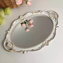 French vintage vanity mirror with ornate gold-tone frame