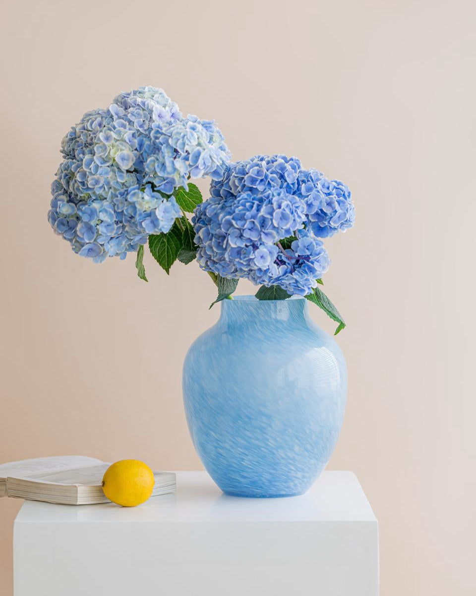 Foggy handcrafted blue glass vase with textured surface