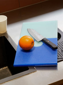 Blue puzzle shaped antimicrobial PE cutting board for kitchen food preparation