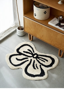 Black and white bowknot area rug with soft tufted texture