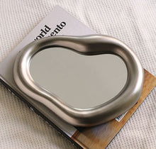 Beige irregular shaped vanity mirror for makeup and dressing table use