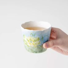 Set of two ceramic lotus tea cups with hand-painted floral design