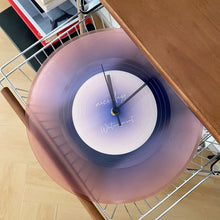 Black vinyl record-inspired clock with stand for wall or tabletop display