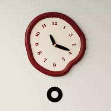 White asymmetrical drip wall clock with a playful melting-inspired shape