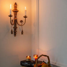 Vintage French-style iron wall candle holder with ornate detailing