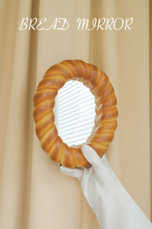 Croissant-shaped decorative desk mirror with textured bread-inspired frame