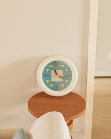 Tennis-inspired wall clock with racket and ball hour markers and pendulum