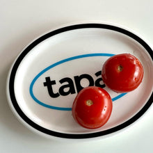 Black oval ceramic tapas plate with graphic text design