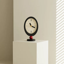 Retro oval wooden desktop clock with red sphere base in black