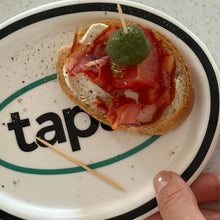 Black oval ceramic tapas plate with graphic text design