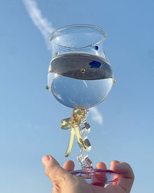 Handmade ribbon charm glass goblet with amber stem, lilac base, and colorful bead accents