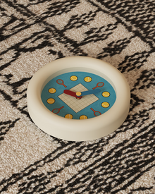 Tennis-inspired wall clock with racket and ball hour markers and pendulum