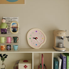 Cream gingham wall clock with wavy frame and colourful dot hour markers