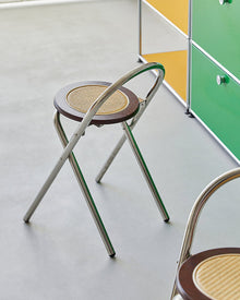 French-inspired walnut rattan folding stool with woven seat