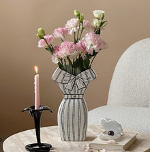 White dress-inspired ceramic vase with black hand-painted line detail