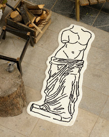 Black and white museum-inspired bedside rug with Leaning Tower of Pisa design
