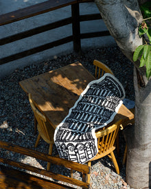 Black and white museum-inspired bedside rug with Leaning Tower of Pisa design
