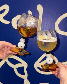 Snowman wine glass with amber star-shaped foot and golden star details