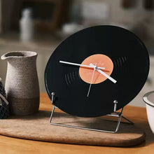 Black vinyl record-inspired clock with stand for wall or tabletop display