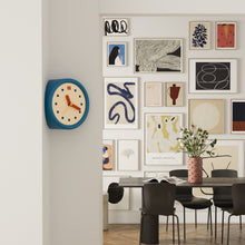 Blue corner wall clock with minimalist dot dial for a 90-degree wall edge