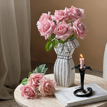 White dress-inspired ceramic vase with black hand-painted line detail